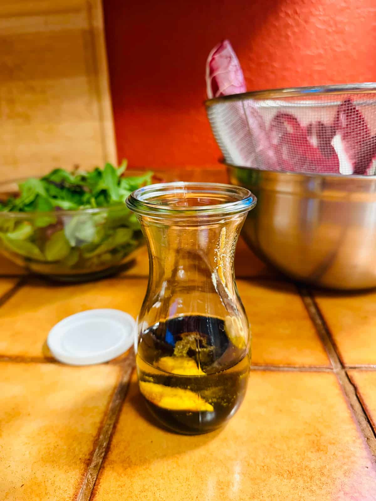 Dressing ingredients in a glass jar.