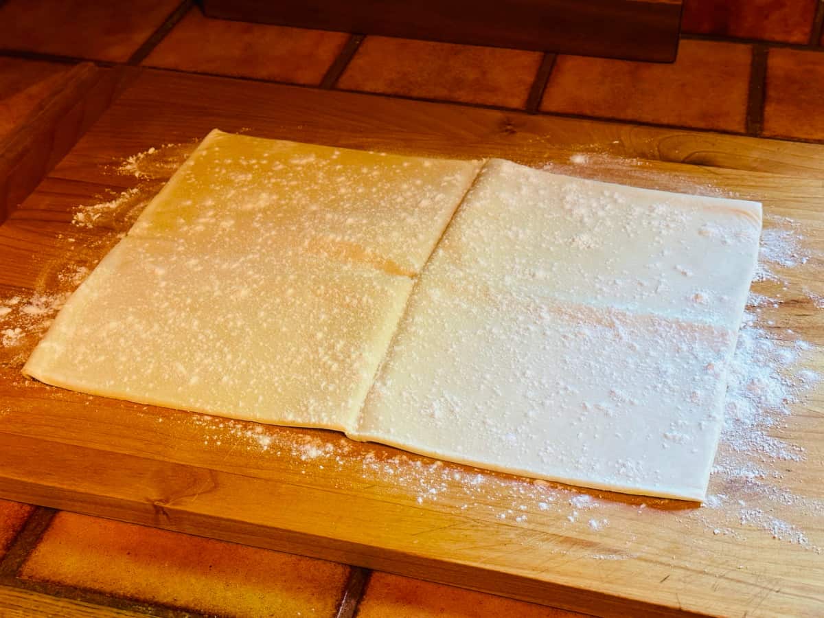 Sheet of puff pastry dough unfolded and lightly floured.