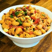 Summer pasta salad in a large white serving bowl.