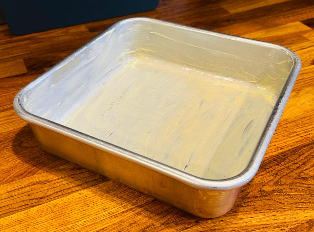 Square metal baking pan greased well with butter.
