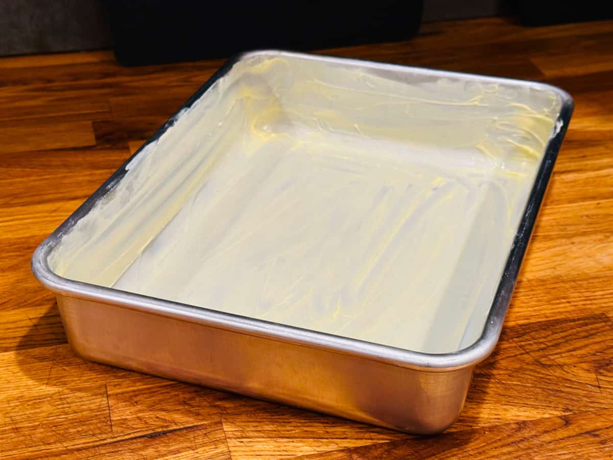 Metal baking pan greased generously with butter.