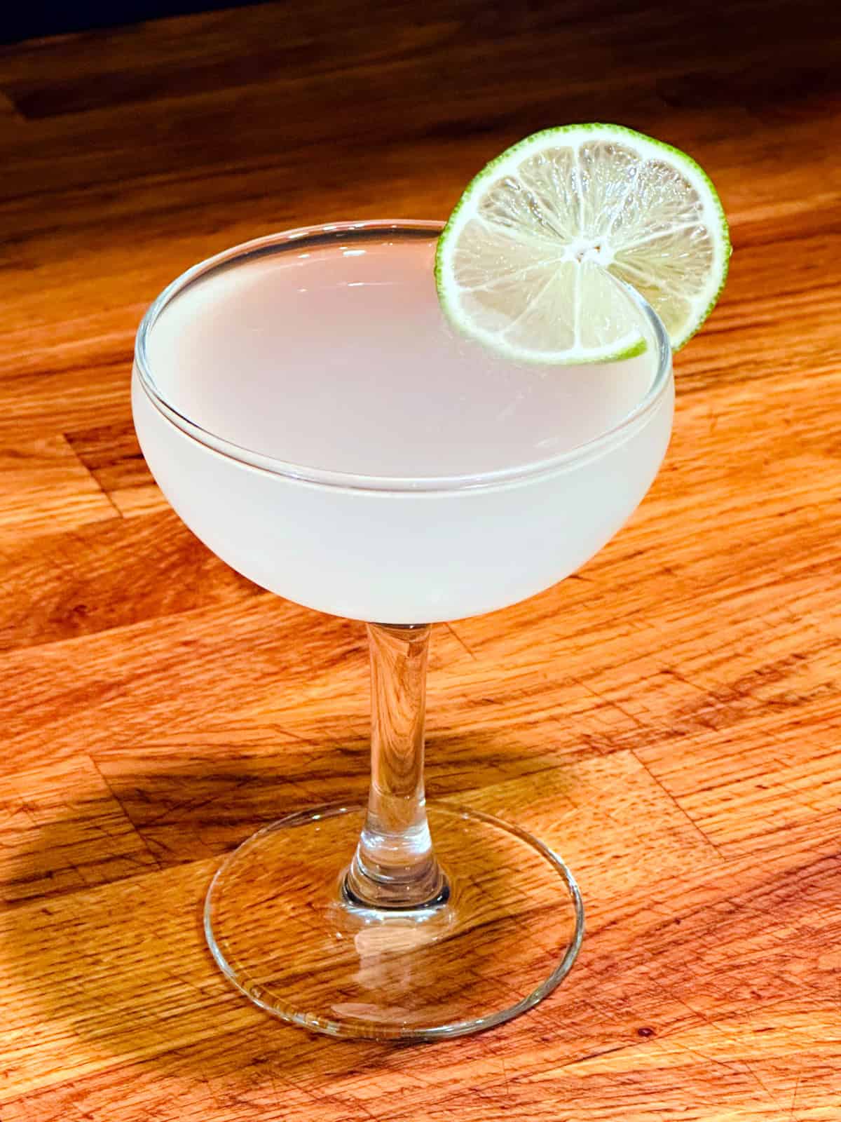 Hemingway daiquiri served in a coupe glass with a lime wheel.