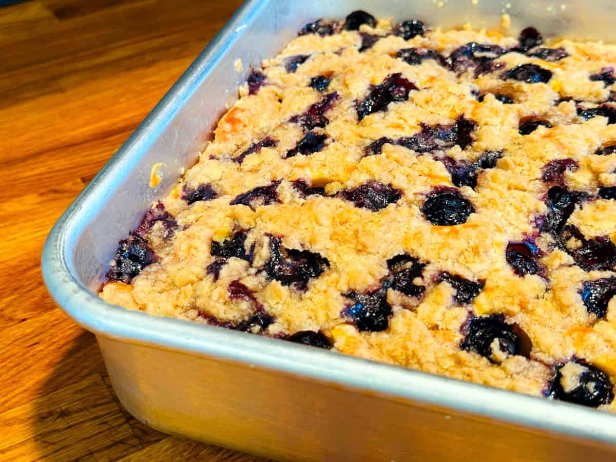 Blueberry buckle cooling in a pan.