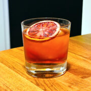 Witches' Negroni in an old fashioned glass.