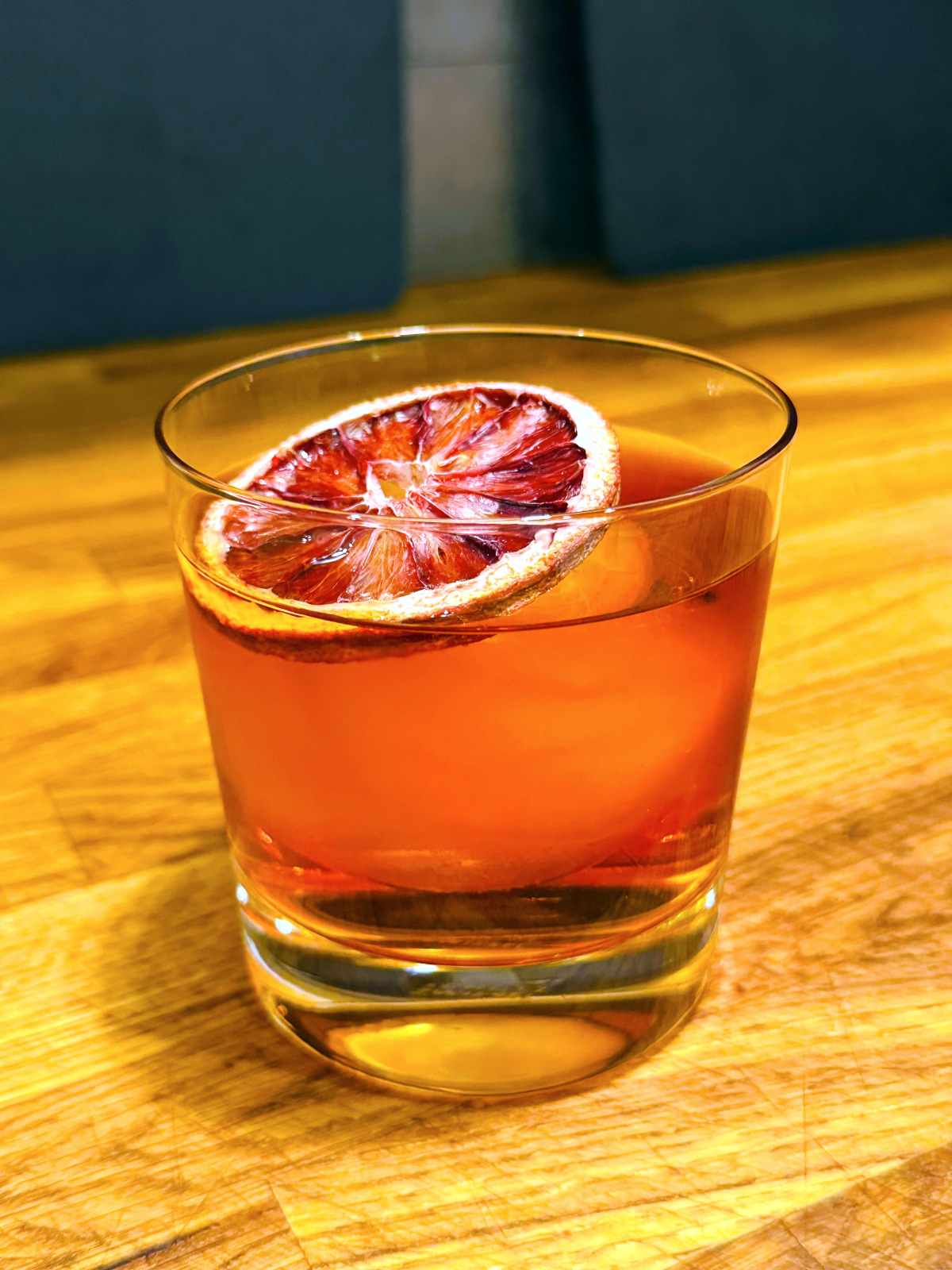 Witches' Negroni in an old fashioned glass.