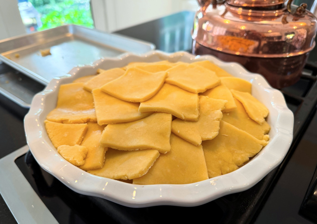 Pastry squares arranged in concentric circles across the top of a deep white pie dish.