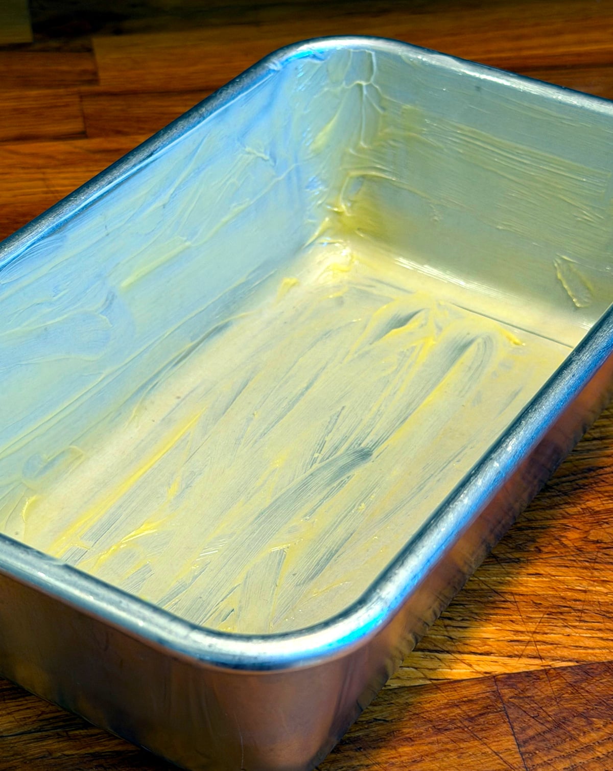 Metal loaf pan generously greased with butter.